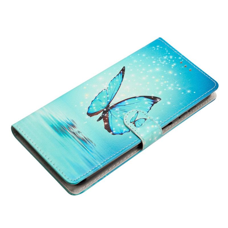 Housse Samsung Galaxy S24 Plus Papillon Bleu en Vol à Lanière