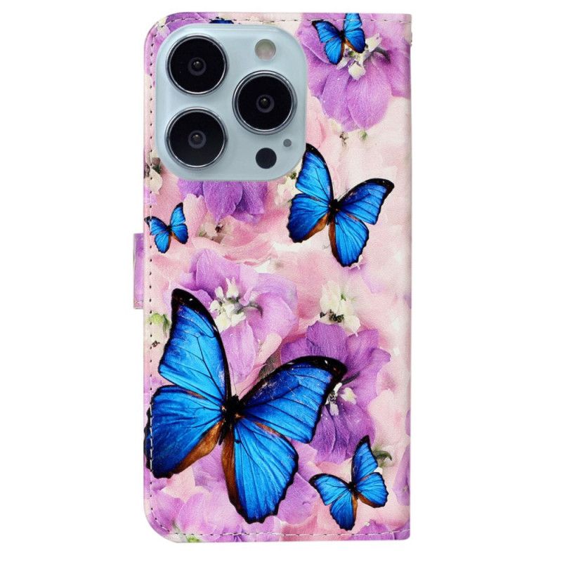 Housse iPhone 16 Pro Max Papillons et Fleurs Pourpres à Lanière