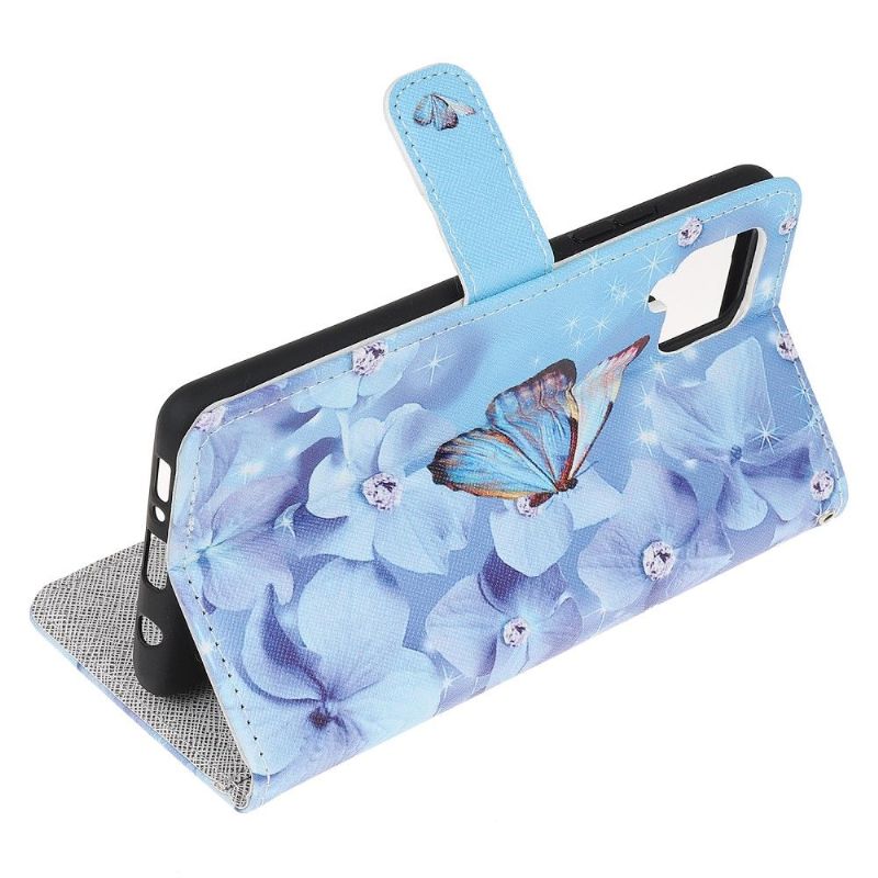 Housse Samsung Galaxy M32 Papillon et fleurs bleues