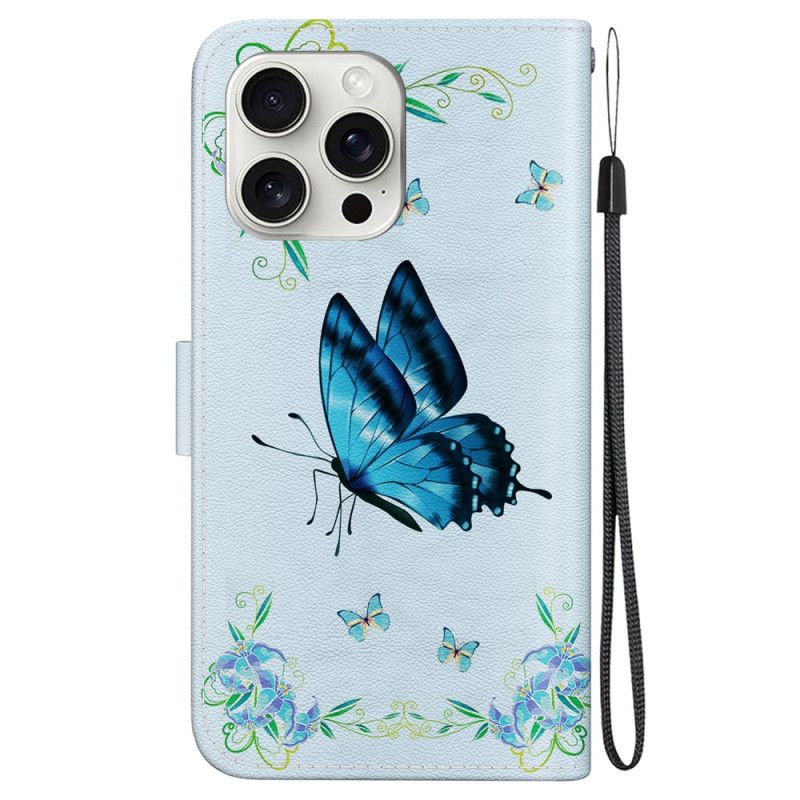 Housse iPhone 16 Pro Papillon Bleu et Fleurs à Lanière