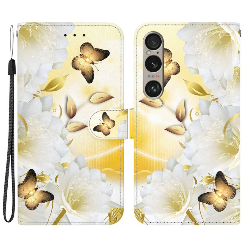 Housse Sony Xperia 1 VI Papillons Dorés et Fleurs Blanches à Lanière